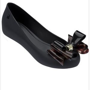 Melissa flats with black and tortoise print bow with gold hardware size 9